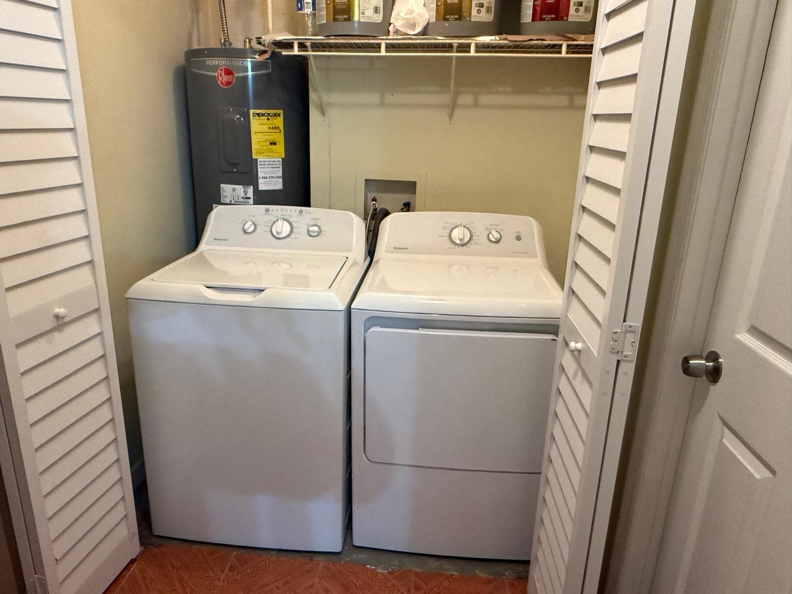 On-site laundry area with washer and dryer at ADOL FOSTER HOME in Tampa.